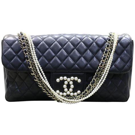 chanel black quilted pearl flap bag|chanel 25cm flap bag.